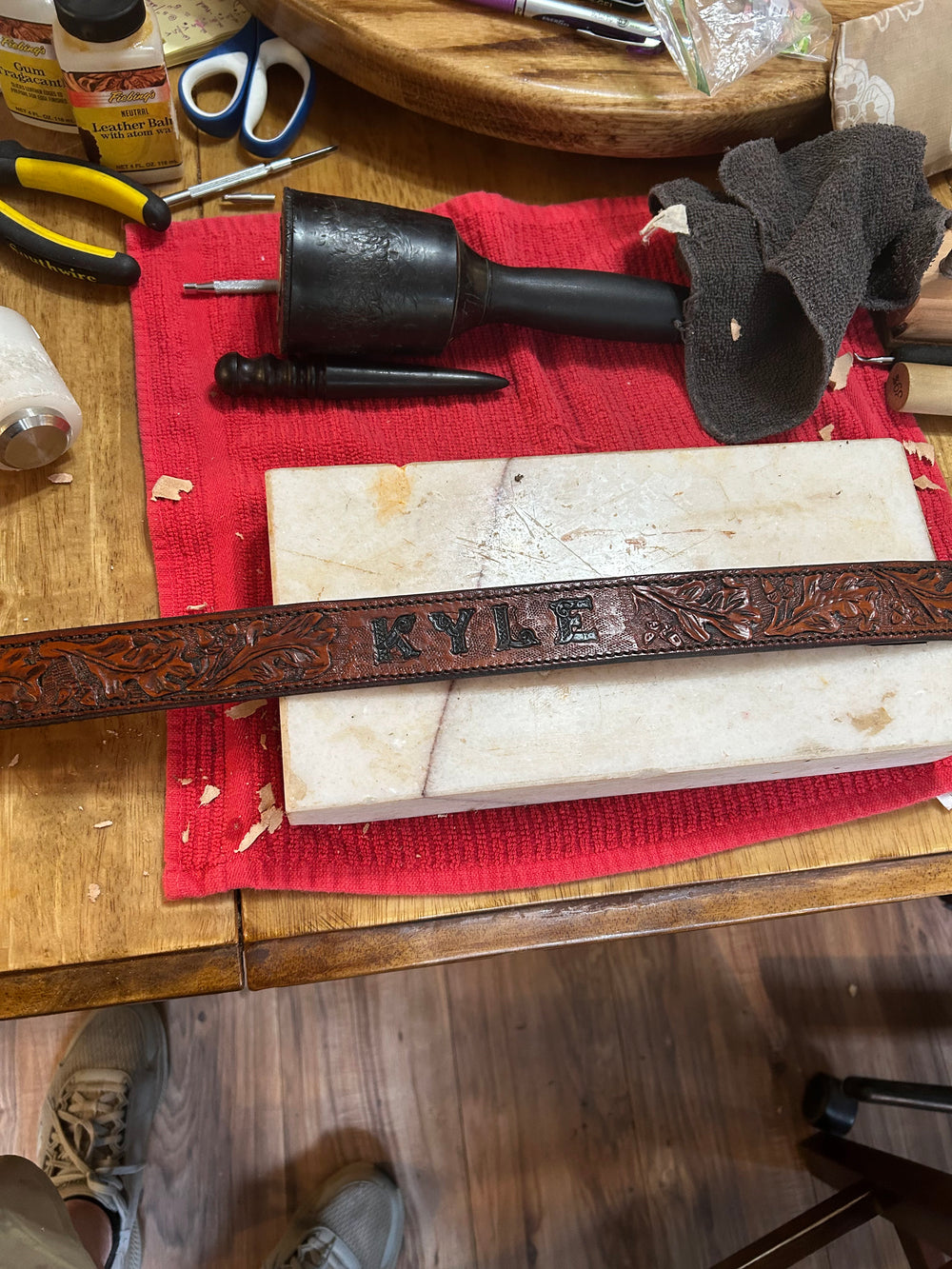 Hand-tooled leatherwork with custom name lettering.